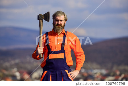 feeling aggressive. mature man builder use axe. professional repairman working with ax tool. build and construction. Skilled architect repair and fix. engineer career. bearded man in uniform 100760796