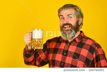 Adding joy in life. Mature bearded man hold beer glass. Happy birthday concept. Make sip. Leisure and celebration. Man drinking beer in pub. Beer brewery. Hipster drink beer. Celebrate with alcohol Adding joy in life. Mature bearded man hold beer glass. Happy birthday concept. Make sip. Leisure and celebration. Man drinking beer in pub. Beer brewery. Hipster drink beer. Celebrate with alcohol 100760801