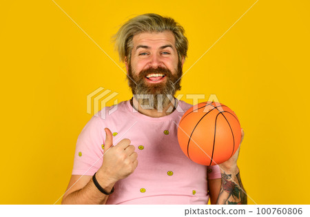 Basketball player on yellow background. Hipster basketball player. Sport concept. Enjoy game. Play with basketball ball. Happy man playing. Hobby and leisure. Healthy lifestyle. Active guy 100760806