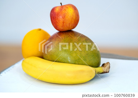 Close up of tropic fruits on a table. Close up of tropic fruits on a table. 100760839