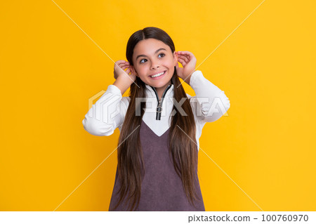 positive child with long hair on yellow background positive child with long hair on yellow background 100760970