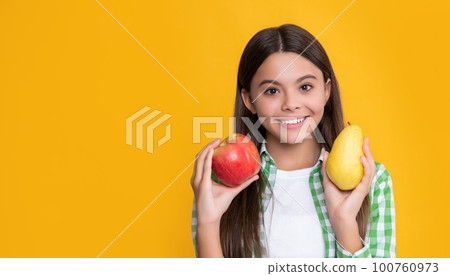 happy kid with apple and pear on yellow background 100760973