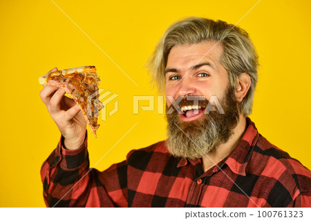 In mood for Italian food. Man bearded hipster hold pizza. Pizza delivery service. Delivering food to apartment. Hungry man going to eat pizza alone. Cheesy taste. Love at first slice. Fresh and hot 100761323