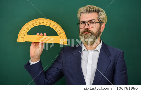 mathematics favorite subject. study geometry lesson. measurement concept. bearded man in suit. math teacher use protractor tool. back to school. college education concept 100761960