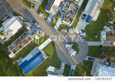 Badly damaged mobile homes after hurricane Ian in Florida residential area. Consequences of natural disaster Badly damaged mobile homes after hurricane Ian in Florida residential area. Consequences of natural disaster 100762037