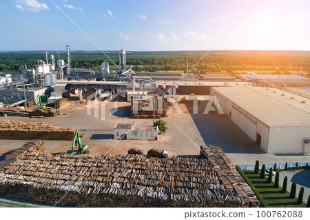Aerial view of wood processing factory with stacks of lumber at plant manufacturing yard. 100762088