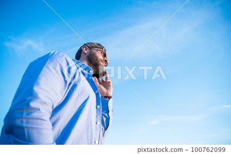 communication of man talk on phone. man talking on smartphone. man communication talk communication of man talk on phone. man talking on smartphone. man communication talk 100762099