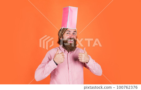 big sale in shopping mall. businessman holding gift pack. gift to colleague at work. surprised man unpacking. the package delivery. human emotion and facial expression. man gift holiday decoration big sale in shopping mall. businessman holding gift pack. gift to colleague at work. surprised man unpacking. the package delivery. human emotion and facial expression. man gift holiday decoration 100762376