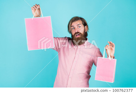 I take two. holiday celebration. surprise for him. shopping and sale. mature brutal hipster with present. buy in mall. happy bearded man holding gift package. happy birthday or anniversary I take two. holiday celebration. surprise for him. shopping and sale. mature brutal hipster with present. buy in mall. happy bearded man holding gift package. happy birthday or anniversary 100762377
