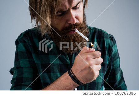 Health safety and addiction. handsome brutal man. bearded man. smoking cigarette habit. brutal hipster with moustache. fashion model wear casual clothes. male beauty standard. looking so trendy 100762390