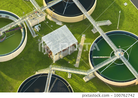 Aerial view of modern water cleaning facility at urban wastewater treatment plant. Purification process of removing undesirable chemicals, suspended solids and gases from contaminated liquid 100762742