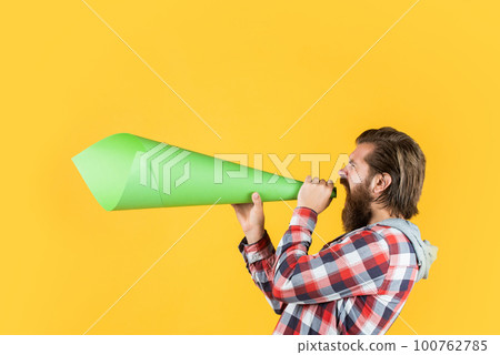 bearded man shout in megaphone. man with paper loudspeaker. freedom of speech. ads for everyone. Promotion and information expansion to masses. mass media concept. make voice louder bearded man shout in megaphone. man with paper loudspeaker. freedom of speech. ads for everyone. Promotion and information expansion to masses. mass media concept. make voice louder 100762785