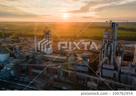 Aerial view of cement factory tower with high concrete plant structure at industrial production area. Manufacturing and global industry concept. 100762954