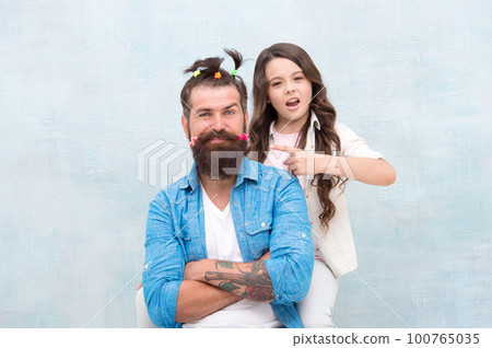 Making me happy. Daughter creating fathers hair. Handsome father with little girl. Happy father and daughter. little girl love her daddy. happy fathers day. family. Fathers day with daughter at home 100765035