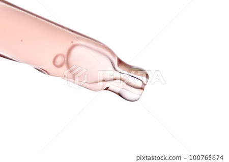 Pipette with a viscous pink cosmetic close-up. Pipette with a viscous pink cosmetic close-up. 100765674