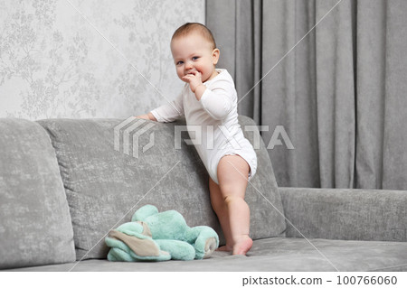 cute baby girl playing with soft toy bunny cute baby girl playing with soft toy bunny 100766060