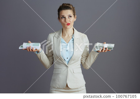 pensive elegant small business owner woman evaluating pensive elegant small business owner woman evaluating 100767105