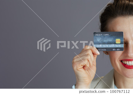 Happy woman worker in light business suit 100767112