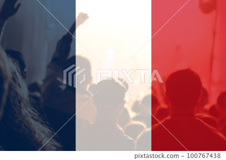 Protests France Paris. France flag. Protest in France. Rise hand. Pension reforms. Out of focus Protests France Paris. France flag. Protest in France. Rise hand. Pension reforms. Out of focus 100767438