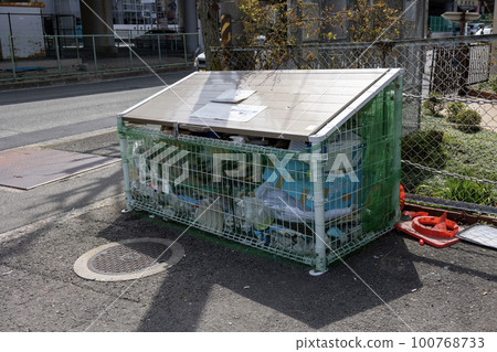 Garbage collection container with a lot of garbage thrown away Garbage collection container with a lot of garbage thrown away 100768733