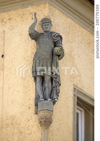 Statue of saint on the house facade in Ptuj, town on the Drava River banks, Lower Styria Region, Slovenia 100770389