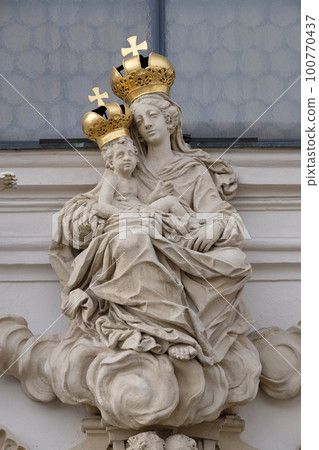 Virgin Mary with baby Jesus on the portal of Mariahilf church in Graz, Styria, Austria 100770437