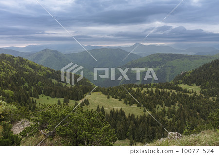 View from Maly Rozsutec to mountain pass Medzirozsutce , Mala Fatra, Slovakia in spring cloudy morning 100771524