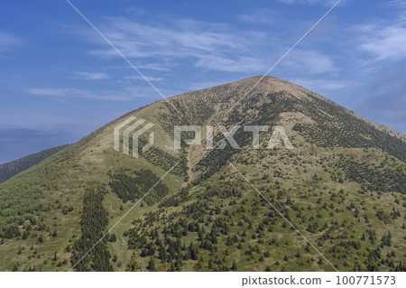 Stoh, mountain in Mala Fatra, Slovakia, view from Poludnovy grun in spring cloudy day 100771573