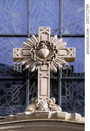 Cross on portal of Parish Church of the Holy Blood in Graz, Styria, Austria Cross on portal of Parish Church of the Holy Blood in Graz, Styria, Austria 100771799