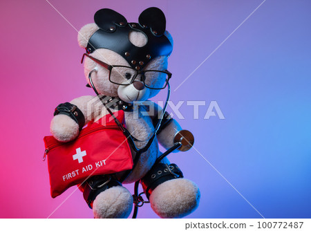 toy teddy bear with leather straps and a mask for BDSM games with a first aid kit , safety and precautions in bdsm sex games toy teddy bear with leather straps and a mask for BDSM games with a first aid kit , safety and precautions in bdsm sex games 100772487