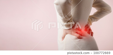 Young woman have waist pain, back ache, lumbar muscle injury problem. Office syndrome disease sick. Healthcare world health day concept. 100772669
