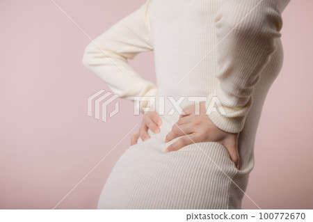 Young woman have waist pain, back ache, lumbar muscle injury problem. Office syndrome disease sick. Healthcare world health day concept. Young woman have waist pain, back ache, lumbar muscle injury problem. Office syndrome disease sick. Healthcare world health day concept. 100772670
