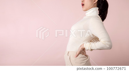 Young woman have waist pain, back ache, lumbar muscle injury problem. Office syndrome disease sick. Healthcare world health day concept. Young woman have waist pain, back ache, lumbar muscle injury problem. Office syndrome disease sick. Healthcare world health day concept. 100772671