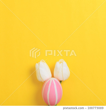 Happy Easter holiday greeting card design concept. Colorful Easter Eggs and spring flowers on yellow background. Flat lay, top view, copy space. Happy Easter holiday greeting card design concept. Colorful Easter Eggs and spring flowers on yellow background. Flat lay, top view, copy space. 100773089