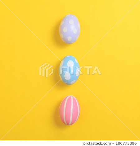 Happy easter holiday celebration concept. Group of painted colourful eggs decoration on a yellow background. Seasonal religion tradition design. Top view, flat lay, copy space. Happy easter holiday celebration concept. Group of painted colourful eggs decoration on a yellow background. Seasonal religion tradition design. Top view, flat lay, copy space. 100773090