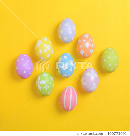 Happy easter holiday celebration concept. Group of painted colourful eggs decoration on a yellow background. Seasonal religion tradition design. Top view, flat lay, copy space. Happy easter holiday celebration concept. Group of painted colourful eggs decoration on a yellow background. Seasonal religion tradition design. Top view, flat lay, copy space. 100773091