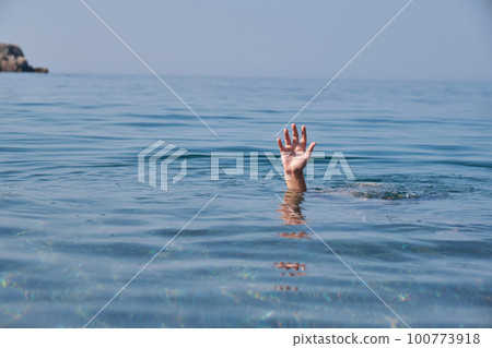 Hand of person drowning in water. Hand of person drowning in water. 100773918