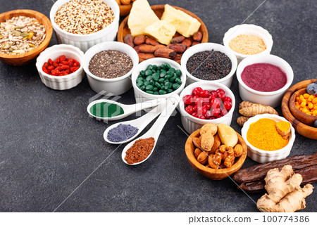 Various superfoods and healthy food supplement. 100774386
