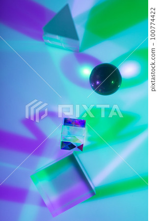 Glass crystal prism. Multicolor light effect 100774422