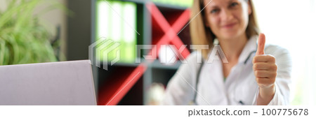 Doctor woman showing thumb up gesture concept Doctor woman showing thumb up gesture concept 100775678