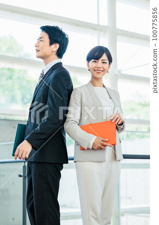 Image of male and female business person Image of male and female business person 100775856