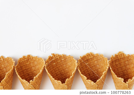Several waffle cones lined in tower, smile, or even row, top vie Several waffle cones lined in tower, smile, or even row, top vie 100778263