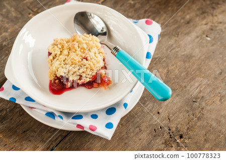 Cherry crumble with fresh cherries 100778323