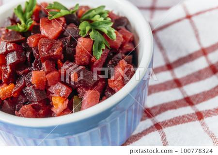 salad vinaigrette on a napkin on a rustic background close-up 100778324