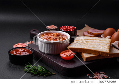 Delicious canned beans in a tomato in a white ceramic bowl Delicious canned beans in a tomato in a white ceramic bowl 100778966
