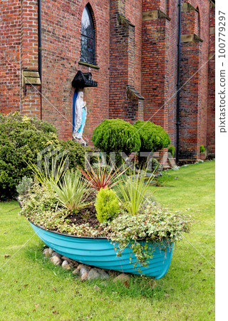 Boat pot in front of St Peters R C Church in Lytham, Lytham St Annes, Fylde Coast, Lancashire United Kingdom 100779297
