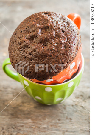 Chocolate pie in a cup filled with a liquid Chocolate pie in a cup filled with a liquid 100780219