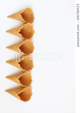 Several waffle cones lined in tower, smile, or even row, top vie Several waffle cones lined in tower, smile, or even row, top vie 100780423