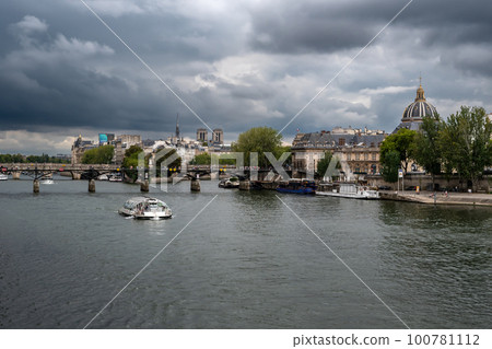 River Seine With Tourist Boat and Bridge Pont Neuf In Front Of Cathedral Notre Dame On Ile De La Cite In Paris, France River Seine With Tourist Boat and Bridge Pont Neuf In Front Of Cathedral Notre Dame On Ile De La Cite In Paris, France 100781112