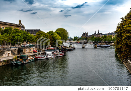 River Seine From Pont Neuf With Ships and Bridge Pont Des Arts In Paris, France 100781147